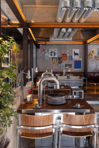 Industrial-style restaurant interior featuring metal and wooden elements