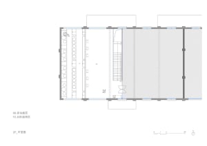 Floor plan of a multi-functional space with seating areas and a staircase.