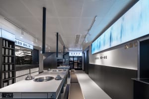 Industrial-style restaurant interior with dark materials and modern design elements