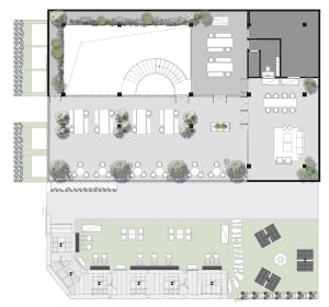 A detailed 2D architectural drawing of a modern office space showing the layout of workstations, meeting areas, and outdoor s