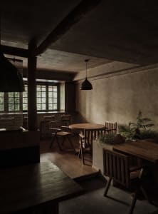 Modern restaurant interior featuring wooden tables and chairs with a warm, industrial ambiance