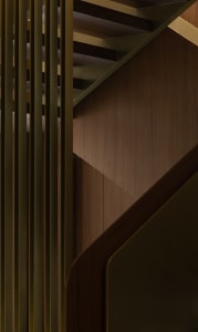 A modern staircase featuring wooden paneling, photographed in a detailed and close-up view.