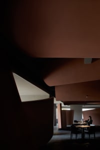 Modern restaurant interior with concrete and wood elements