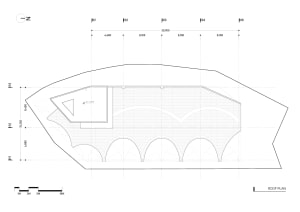 A modern roof plan with concrete structural elements, detailing straight and curved lines, and dimensions indicated for archi