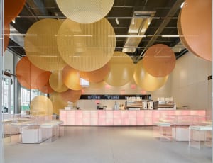 A modern coffee shop featuring transparent disks as decor elements.