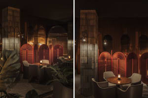 Industrial-themed restaurant interior with red metallic screens and dim lighting