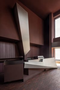 Modern minimalist architecture featuring concrete materials and clean lines.