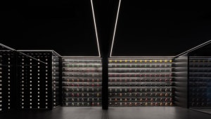 A minimalist storefront with black glass walls.