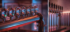 Metal bar taps with industrial design in a bar setting.