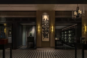 A stylish, luxury lobby with wood paneling.