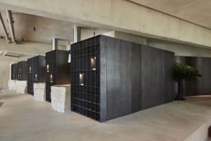 An industrial interior space with concrete walls and minimalist design elements.