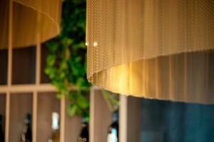 Close-up of a textured fabric in a residential interior setting.