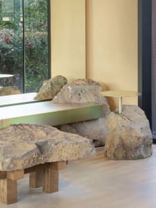 A modern interior featuring stone and concrete materials