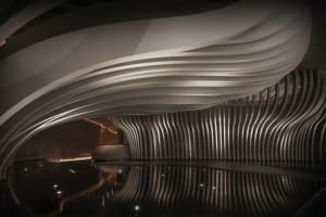 Modern spa interior with wooden materials and curved walls