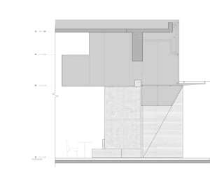 Modern residential interior design featuring a concrete and metal floor plan.