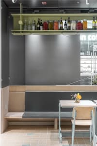 A minimalist restaurant interior with modern furniture and a sleek, contemporary design.