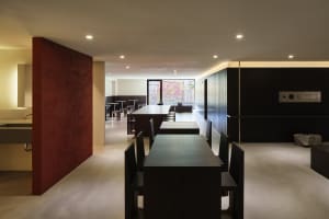 Modern commercial space featuring sleek concrete black-walls with industrial styling.