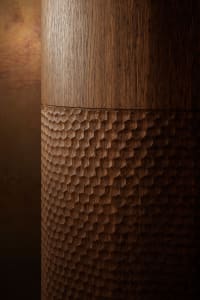 A modern interior space featuring intricate wood carvings.