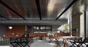 Modern coffee shop interior with brick walls, concrete floors, and stainless-steel accents.