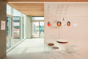 Modern office space featuring concrete, wood, and tile materials