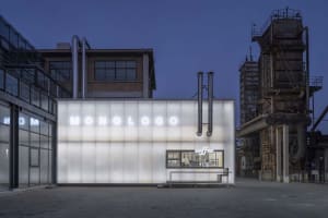 A minimalist coffee shop exterior with glass paneling.
