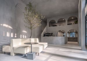 Modern coffee shop interior designed with concrete materials