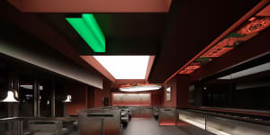 The modern interior design of a restaurant featuring steel, glass, and terrazzo materials.