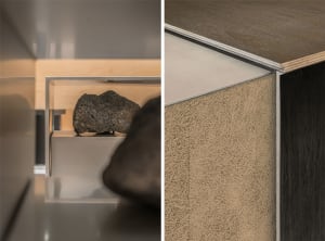 Close-up of a modern interior design, featuring minimalist aesthetics with metal, wood, and paper materials.