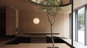 Modern restaurant interior designed with wood flooring and minimalist decor.