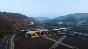 A modern education center with a combination of wood and concrete materials
