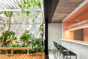 Contemporary coffee shop featuring a sleek stone bar counter