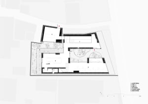 Modern campus building with concrete and glass materials, featuring a floor plan layout.