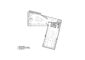 Schematic layout of a modern restaurant featuring concrete materials and a bar area.