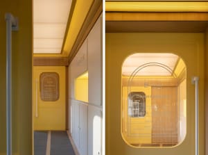 A modern office space featuring yellow walls, white paneling, and wooden trim, with a storage area labeled 'storage.'