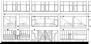 Industrial office interior with steel-frame structure and large windows