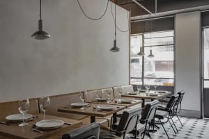 A modern restaurant dining area with sleek, contemporary design elements.