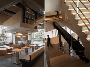 Interior of a modern industrial restaurant featuring concrete, glass, and steel materials.