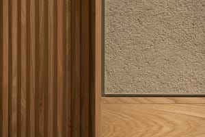 A minimalist interior with wooden panels and textured plaster walls.