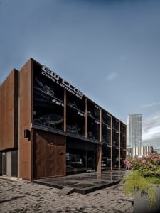 Industrial building with a metal exterior featuring a large window display.