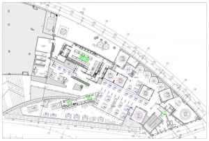 2D architectural drawing of a cafeteria layout on blueprint paper