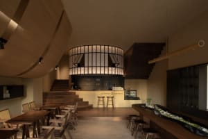 A modern coffee shop interior with wooden finishes and a circular seating area.