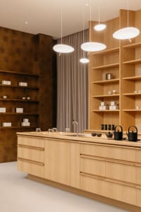 A minimalist commercial interior designed with wooden materials.
