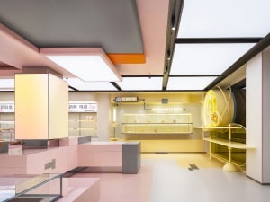 A minimalist shop interior featuring glass elements.