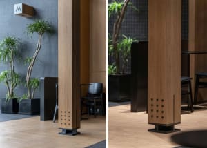 Modern lobby with wooden columns and potted plants