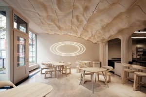 Marbled wood tables and chairs in a modern restaurant interior