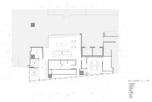 Floor plan of an office building showing offices, conference room, and interior design features.