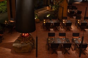 Industrial restaurant with brick walls and folding chairs.