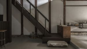 A modern minimalist interior space with wooden features.