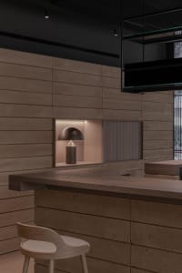 Modern interior design showcasing wooden and concrete structural elements.