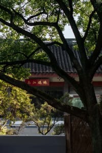 A traditional Chinese exterior featuring wooden beams and brick walls.